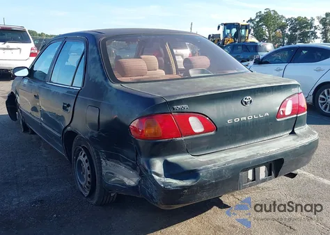 1999 Toyota Corolla Ce из США, поврежденный, VIN 2T1BR12E4XC238429